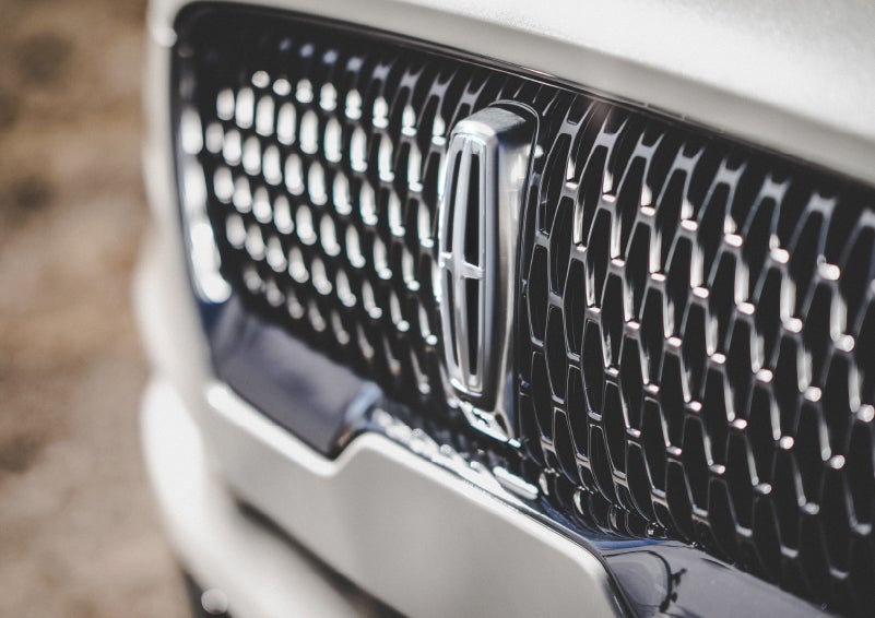 The grille of the 2024 Lincoln Aviator® Reserve model with an eye-catching repeated field of Lincoln Star logo shapes | Wallace Lincoln in Fort Pierce FL