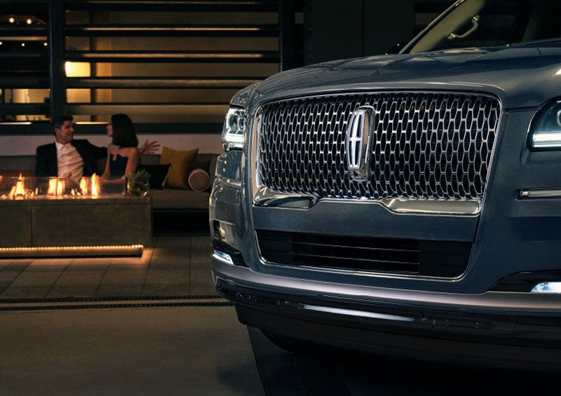 The front grille of a 2023 Lincoln Navigator® SUV is elegantly illuminated. | Wallace Lincoln in Fort Pierce FL