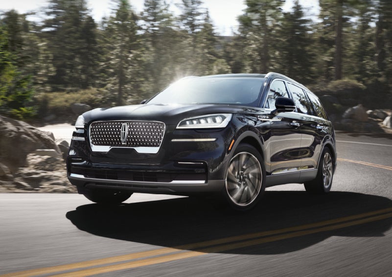 A Lincoln Aviator® SUV is being driven on a winding mountain road | Wallace Lincoln in Fort Pierce FL