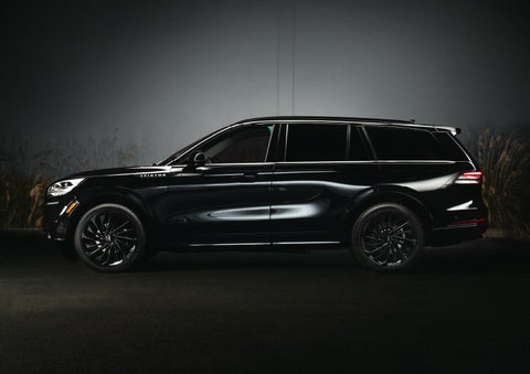 A 2024 Lincoln Aviator® SUV is shown in the Infinite Black exterior color | Wallace Lincoln in Fort Pierce FL