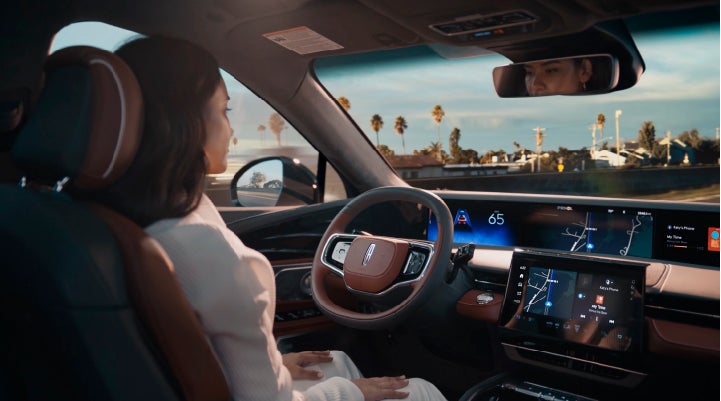 A person is shown driving hands-free on the highway with available Lincoln BlueCruise technology. | Wallace Lincoln in Fort Pierce FL