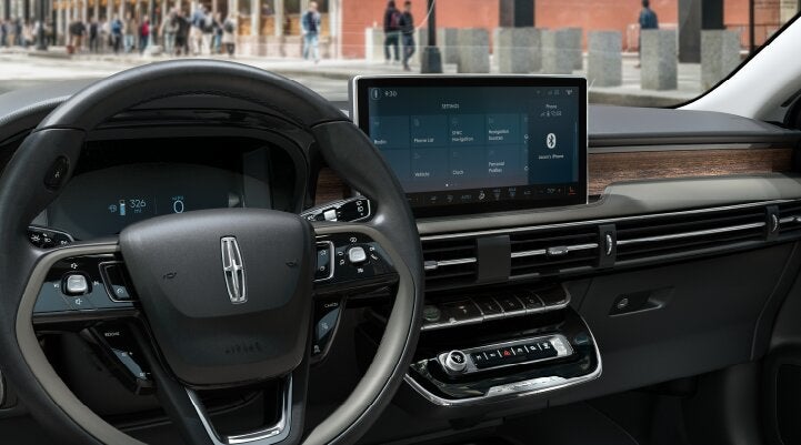 The center screen of the new 2025 Lincoln Corsair® SUV is showcased with its SYNC® 4 capabilities highlighted | Wallace Lincoln in Fort Pierce FL