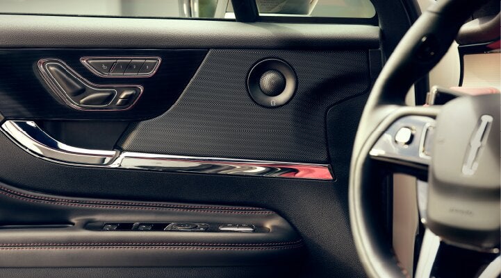 A Revel® audio speaker is shown in the driver's side door of a 2025 Lincoln Corsair® SUV. | Wallace Lincoln in Fort Pierce FL
