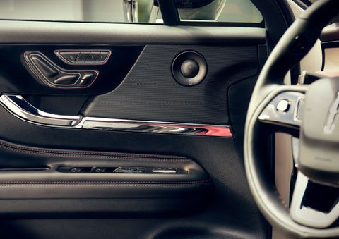 The driver of a 2024 Lincoln Corsair® SUV is shown selecting the drive mode. | Wallace Lincoln in Fort Pierce FL