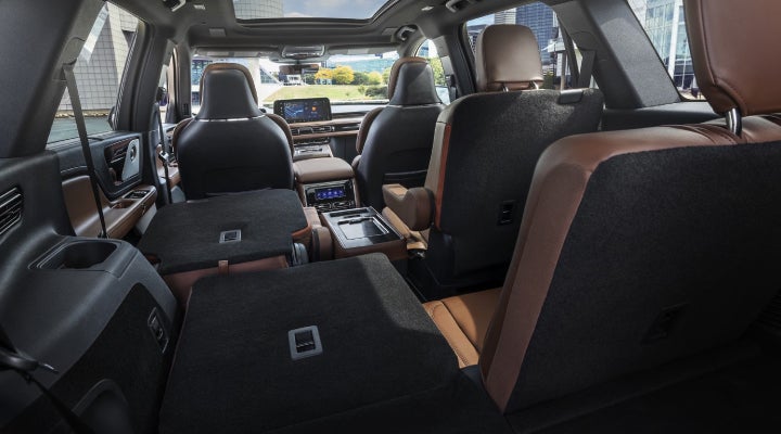 One side of the PowerFold® third-row seat and a second-row seat are folded forward in the 2026 Lincoln Aviator® SUV. | Wallace Lincoln in Fort Pierce FL