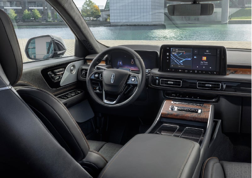The interior of the 2026 Lincoln Aviator® SUV is shown parked with a view of a harbor through the windshield. | Wallace Lincoln in Fort Pierce FL