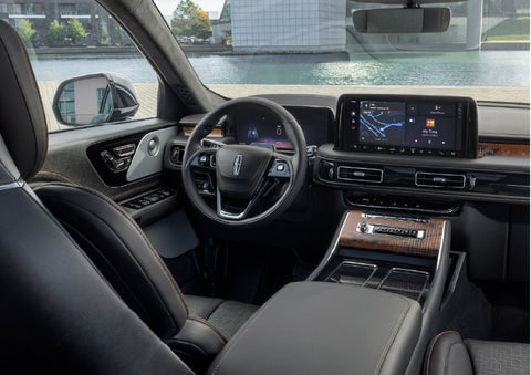 The interior of the 2026 Lincoln Aviator® SUV is shown parked with a view of a harbor through the windshield. | Wallace Lincoln in Fort Pierce FL