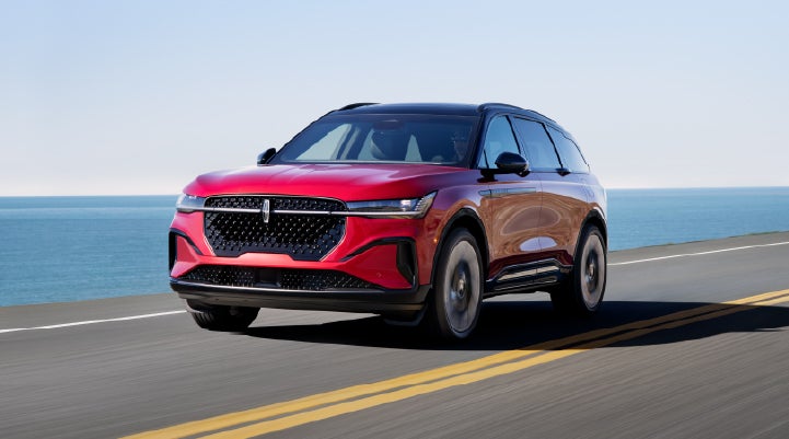 A 2026 Lincoln Nautilus® SUV is being driven on a seaside roadway. | Wallace Lincoln in Fort Pierce FL