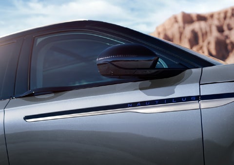 Blue lettering on the side of the vehicle that reads Nautilus indicates the available Hybrid Powertrain. | Wallace Lincoln in Fort Pierce FL