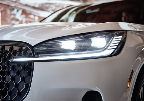 A close-up of a headlamp on the 2027 Lincoln Aviator® SUV is shown. | Wallace Lincoln in Fort Pierce FL