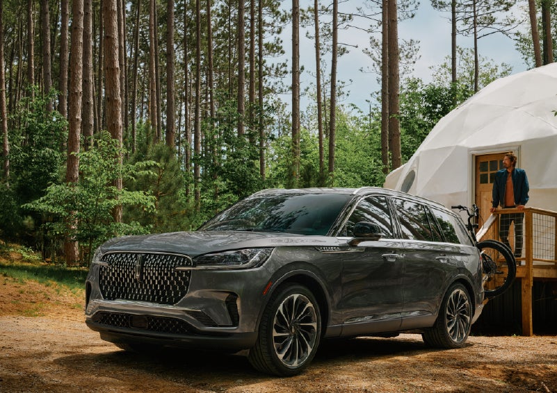 A 2027 Lincoln Aviator® is parked next to a high end glamping site. | Wallace Lincoln in Fort Pierce FL